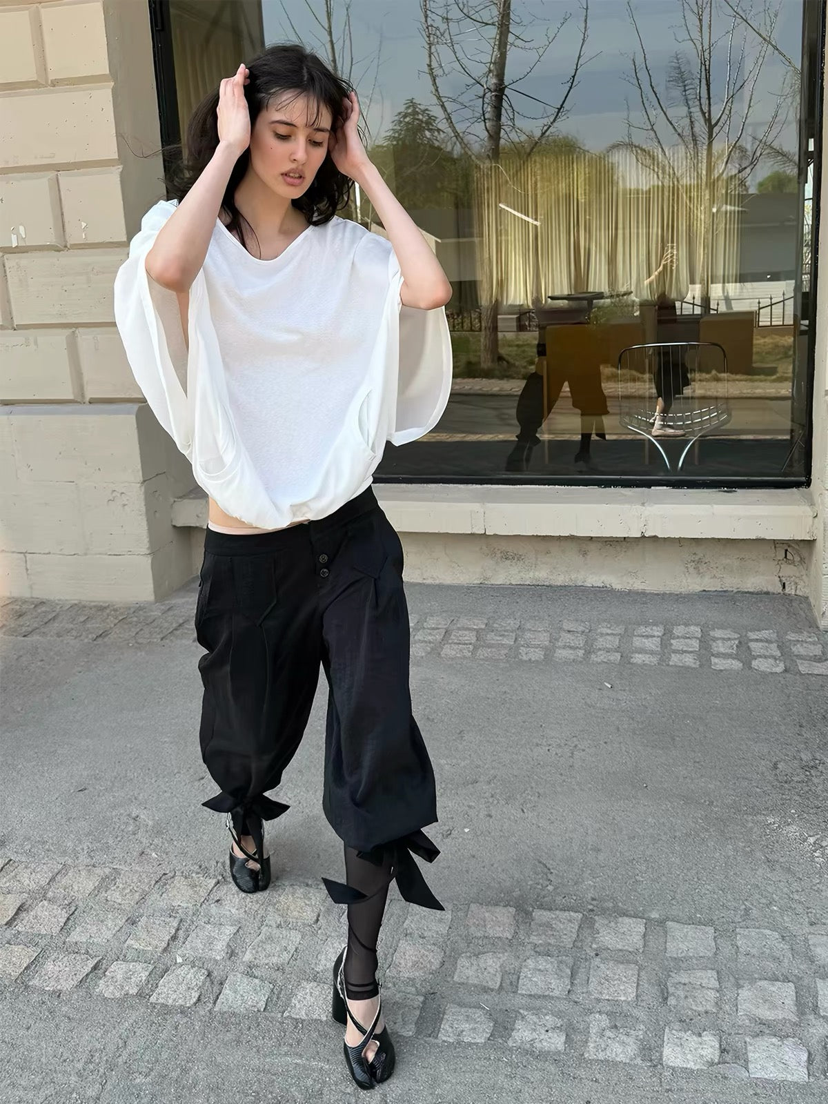 That’s neat Low-Rise Studded Tie Cuff Capri Trousers