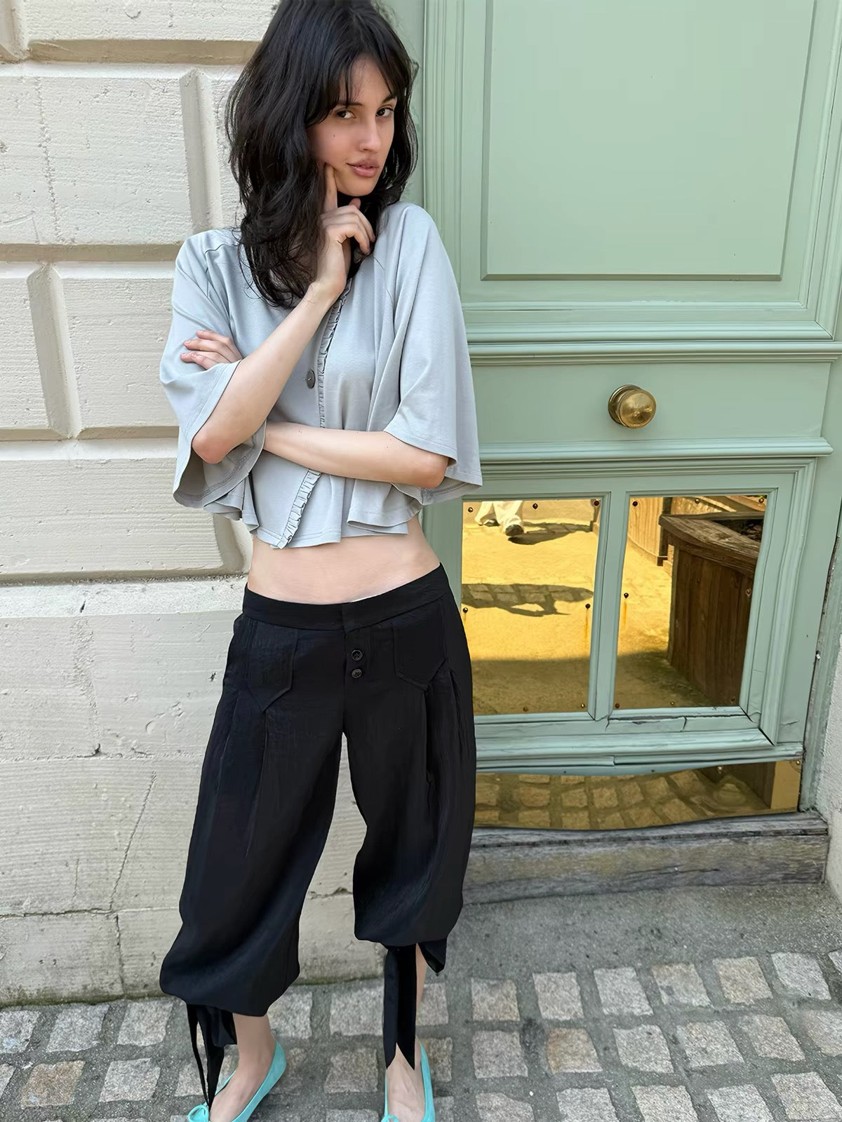 That’s neat Low-Rise Studded Tie Cuff Capri Trousers
