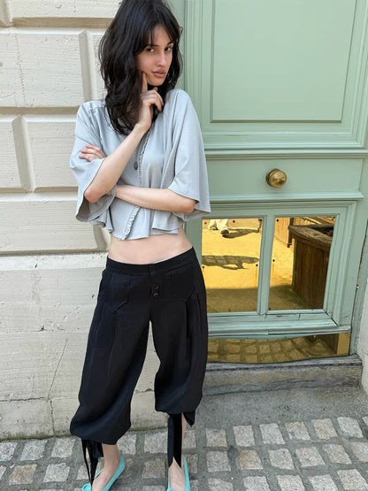 That’s neat Low-Rise Studded Tie Cuff Capri Trousers