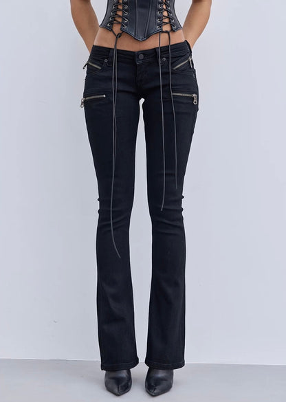 Black flared jeans with zippers on a white background