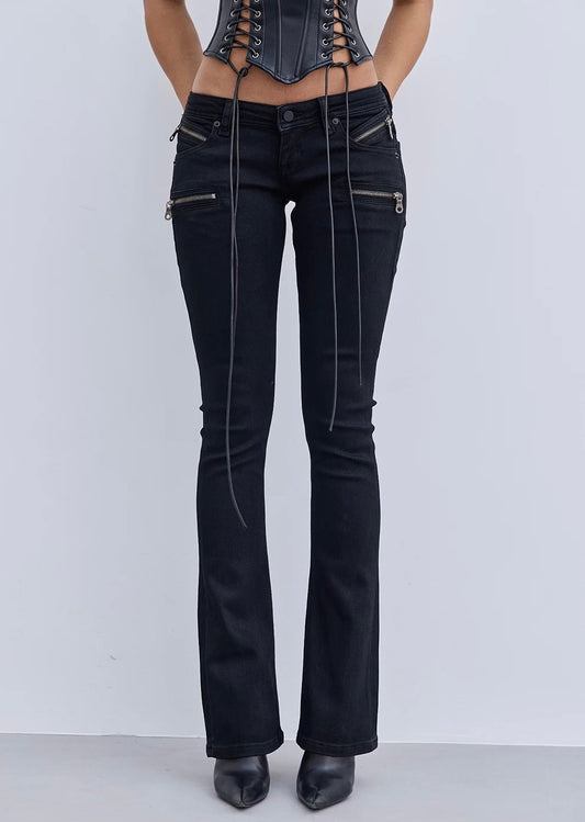 Black flared jeans with zippers on a white background