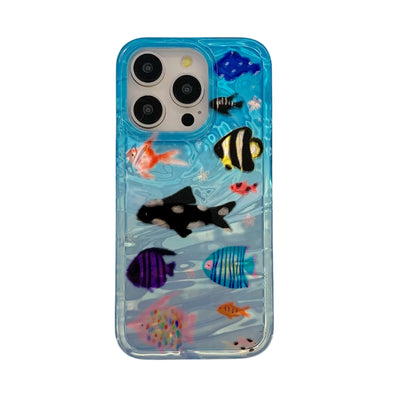 blue iphone case with 3d effect and various shaped fishes on a blue ocean background 