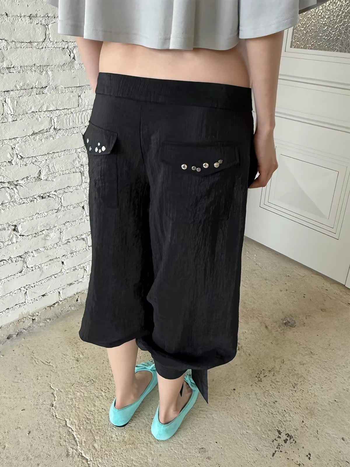 That’s neat Low-Rise Studded Tie Cuff Capri Trousers